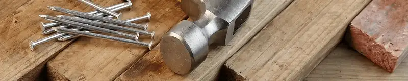Hammer and nails on hardwood flooring boards in Boise, ID