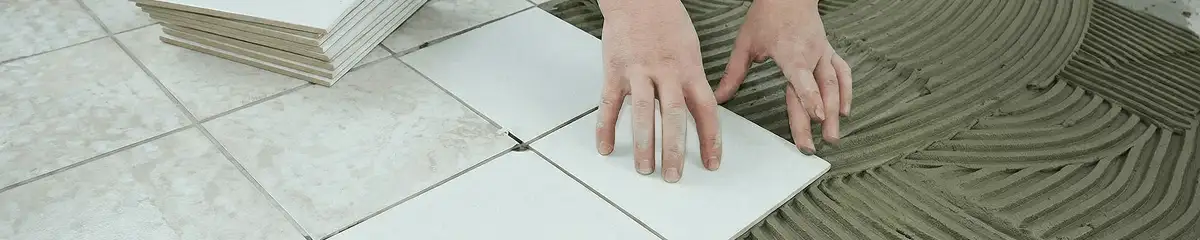Professional installing white tile floors in Boise, ID