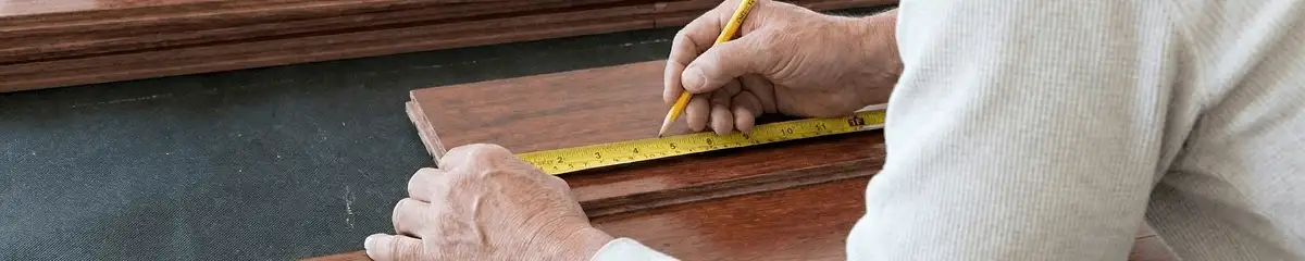 A professional installing wood flooring in Boise, ID